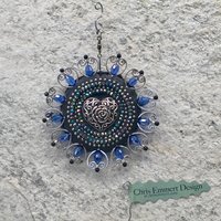 Blue Hearts garden spinner. Chris Emmert mosaic art.