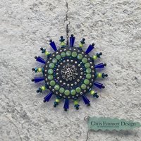 Blue Roses garden spinner. Chris Emmert mosaic art.
