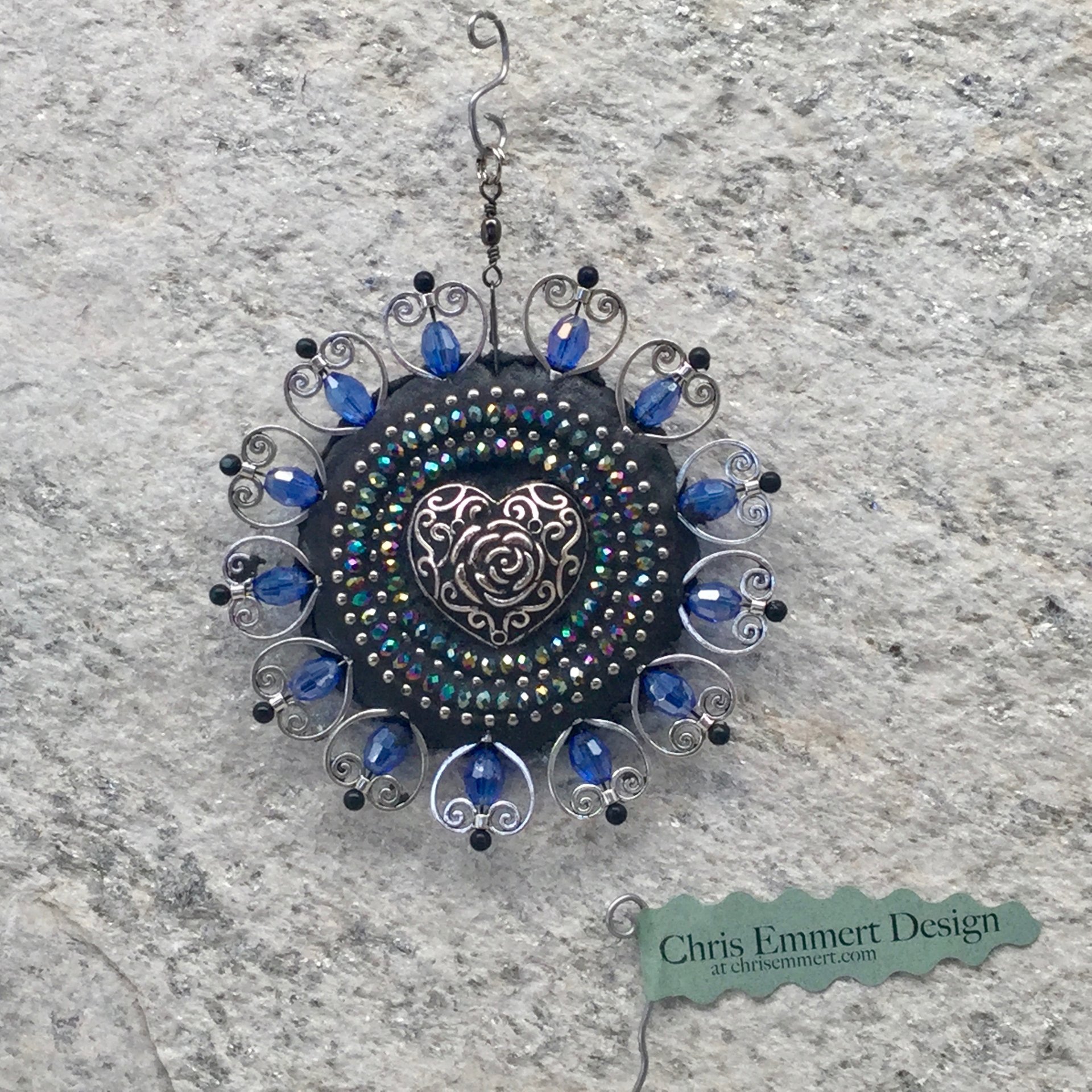 Blue Hearts garden spinner. Chris Emmert mosaic art.