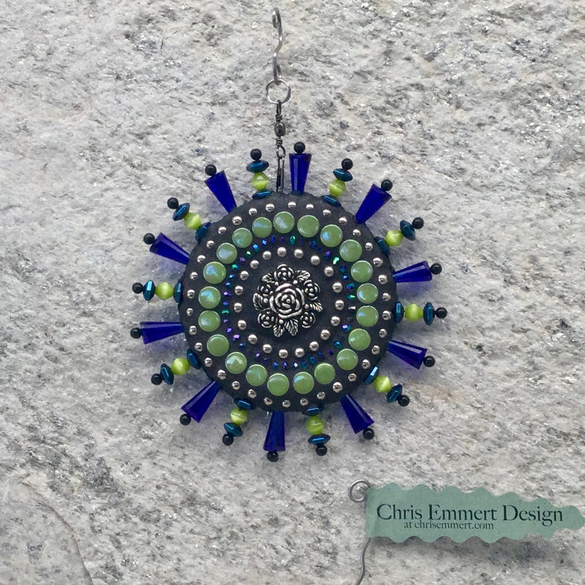 Blue Roses garden spinner. Chris Emmert mosaic art.
