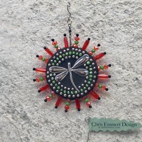 Dragonfly garden spinner.  Chris Emmert mosaic. Orange rays.