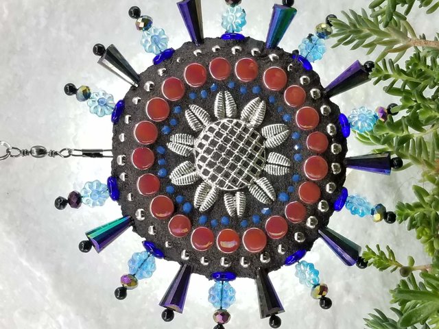 Purple sunflower garden wind spinner.  Chris Emmert mosaic.