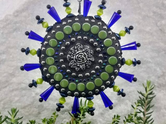 mosaic wind spinner in blues by chris emmert